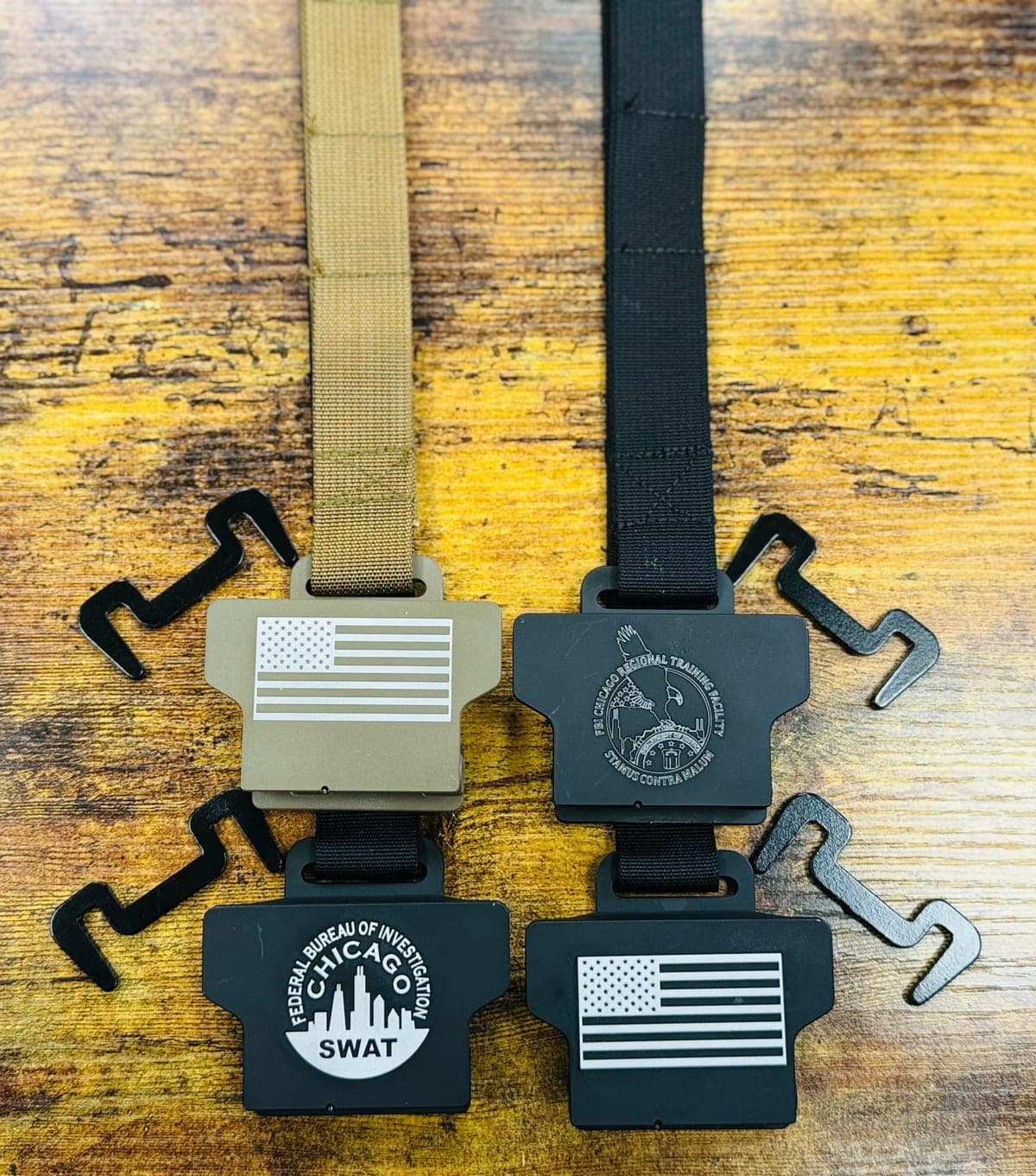 Tactical Shield Hook hardware detail — MOLLE clips and reinforced strap stitching
